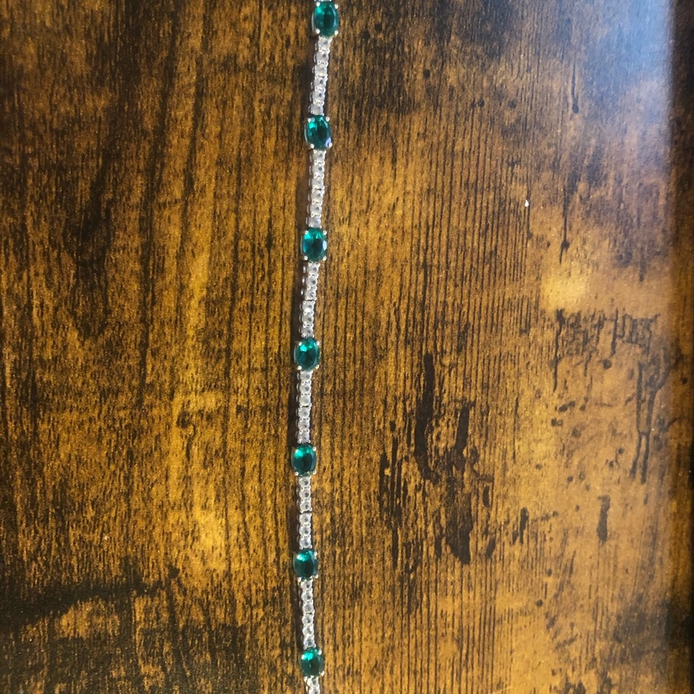 Lab created emerald and white sapphire bracelet